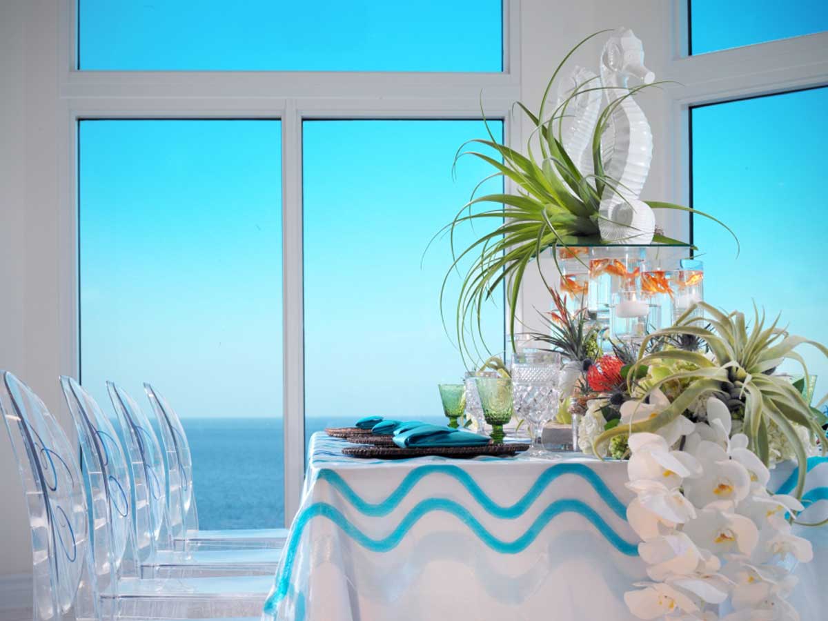 Wedding reception table with an ocean view.
