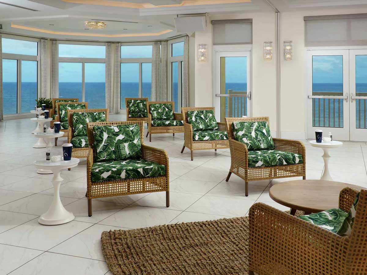 Meeting venue setup with chairs and ocean view